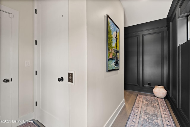 104 Howard Ln, Jeffersonville, IN 47130 - corridor featuring wood finished floors and a decorative wall