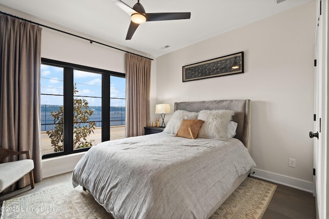104 Howard Ln, Jeffersonville, IN 47130 - bedroom with wood finished floors, a ceiling fan, and a water view