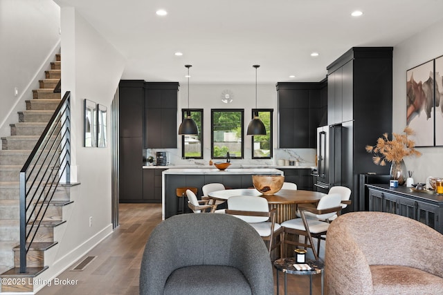 104 Howard Ln, Jeffersonville, IN 47130 - dining area featuring stairs, recessed lighting, and wood finished floors