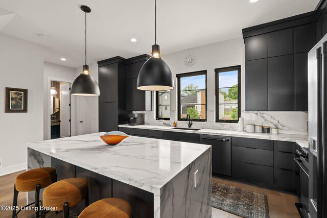 104 Howard Ln, Jeffersonville, IN 47130 - kitchen with dishwasher, dark cabinetry, a kitchen island, modern cabinets, and recessed lighting