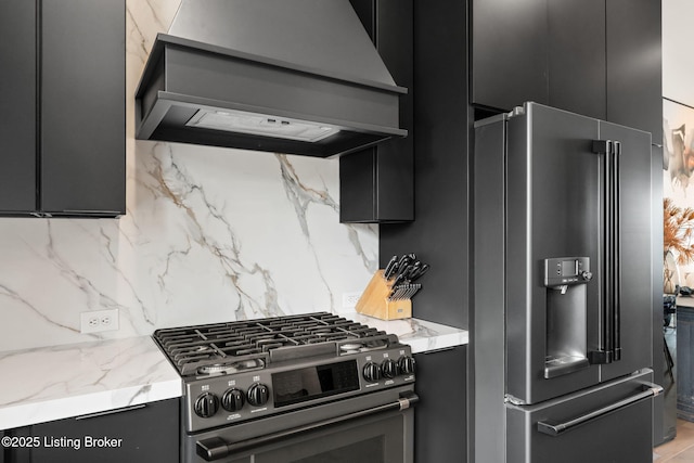 104 Howard Ln, Jeffersonville, IN 47130 - kitchen featuring custom exhaust hood, stainless steel refrigerator with ice dispenser, black gas stove, decorative backsplash, and dark cabinetry