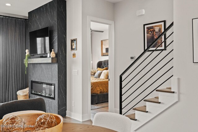 104 Howard Ln, Jeffersonville, IN 47130 - stairs featuring wood finished floors, recessed lighting, and a premium fireplace