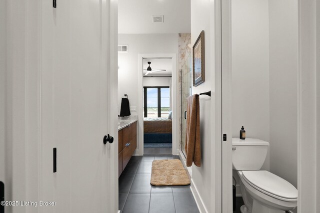 104 Howard Ln, Jeffersonville, IN 47130 - ensuite bathroom with tile patterned floors, vanity, and ceiling fan