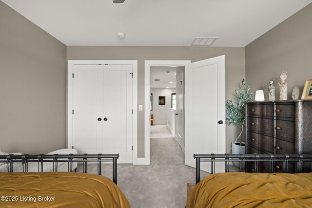 104 Howard Ln, Jeffersonville, IN 47130 - carpeted bedroom with a closet and baseboards
