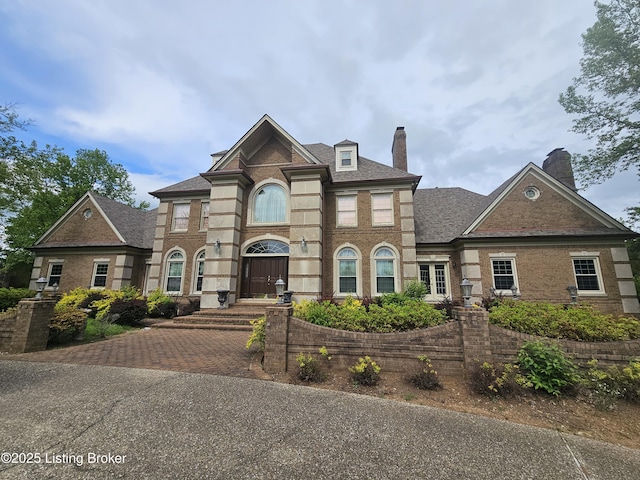 3501 Trinidad Ct, Lexington, KY 40509 - georgian-style home featuring a chimney and brick siding
