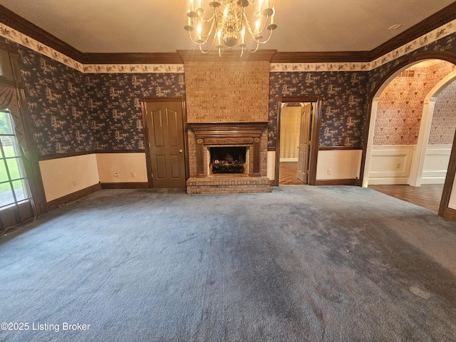 3501 Trinidad Ct, Lexington, KY 40509 - unfurnished living room with wallpapered walls, carpet floors, a wainscoted wall, a chandelier, and crown molding