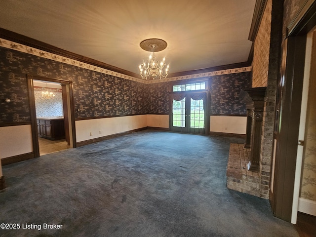 3501 Trinidad Ct, Lexington, KY 40509 - unfurnished living room with wallpapered walls, a chandelier, french doors, a wainscoted wall, and dark colored carpet