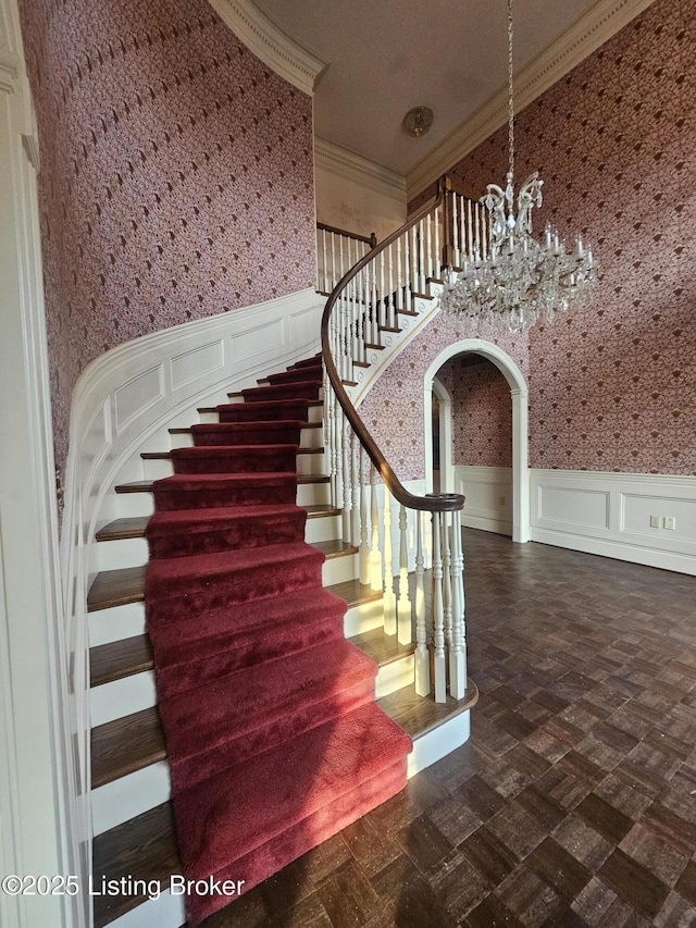 3501 Trinidad Ct, Lexington, KY 40509 - stairway with a decorative wall, a chandelier, crown molding, wallpapered walls, and a wainscoted wall