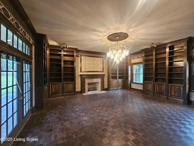 3501 Trinidad Ct, Lexington, KY 40509 - unfurnished living room with built in features, a chandelier, a fireplace, and french doors