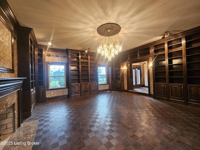 3501 Trinidad Ct, Lexington, KY 40509 - unfurnished living room with built in shelves, a fireplace with flush hearth, a chandelier, and healthy amount of natural light