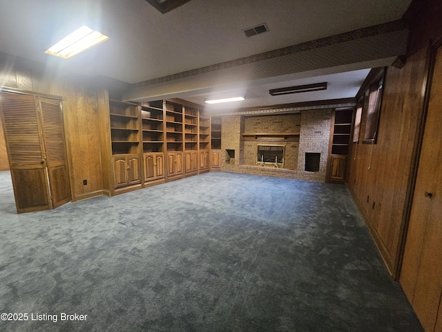 3501 Trinidad Ct, Lexington, KY 40509 - unfurnished living room featuring a fireplace, wood walls, carpet floors, built in features, and beam ceiling