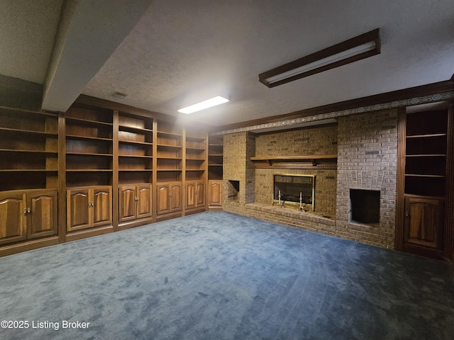 3501 Trinidad Ct, Lexington, KY 40509 - unfurnished living room featuring a fireplace, carpet floors, a textured ceiling, and built in shelves