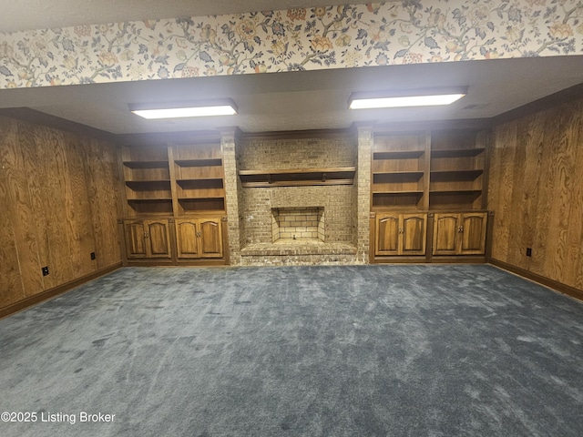 3501 Trinidad Ct, Lexington, KY 40509 - unfurnished living room featuring wood walls, carpet flooring, a fireplace, and built in shelves