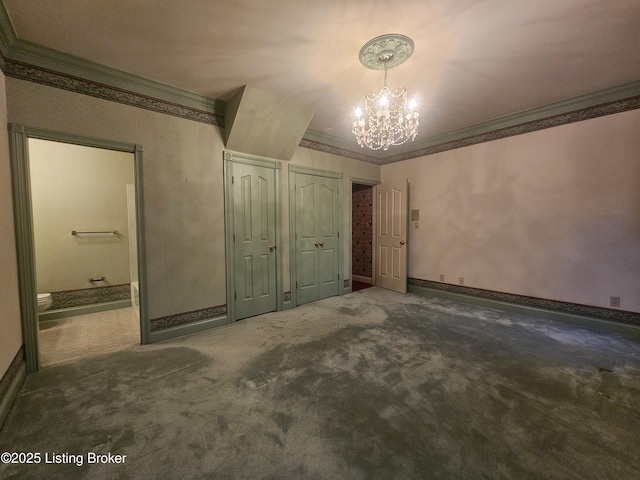 3501 Trinidad Ct, Lexington, KY 40509 - unfurnished bedroom with a chandelier, ornamental molding, two closets, carpet flooring, and ensuite bathroom