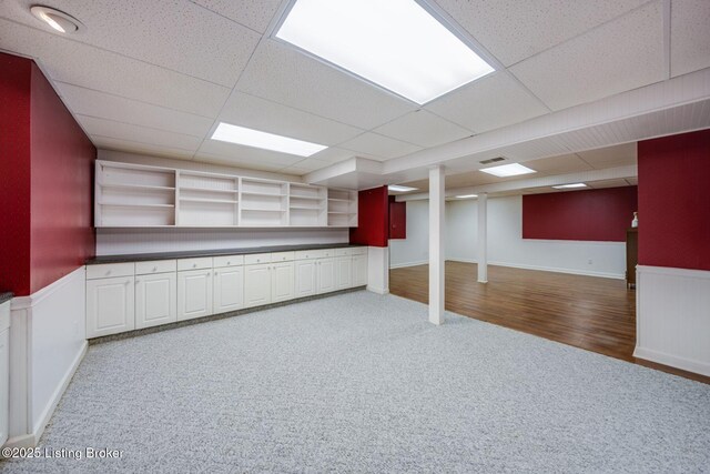 8415 Hurstbourne Woods Pl, Louisville, KY 40299 - finished basement featuring carpet flooring, a drop ceiling, and wainscoting