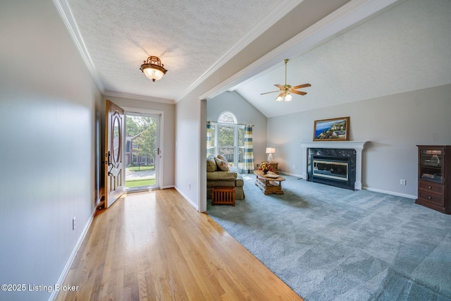 8415 Hurstbourne Woods Pl, Louisville, KY 40299 - living area with ceiling fan, a high end fireplace, lofted ceiling, a textured ceiling, and wood finished floors