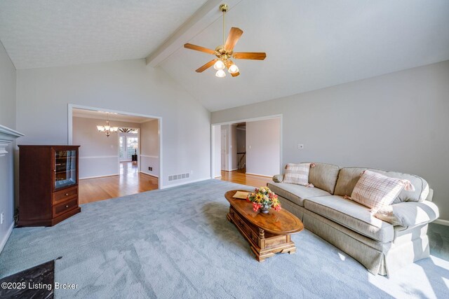 8415 Hurstbourne Woods Pl, Louisville, KY 40299 - carpeted living room featuring a chandelier and a ceiling fan