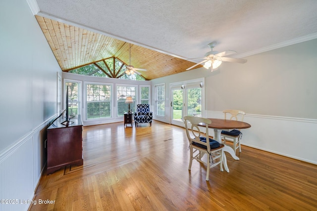 8415 Hurstbourne Woods Pl, Louisville, KY 40299 - dining room featuring ceiling fan, vaulted ceiling, wood finished floors, and wainscoting