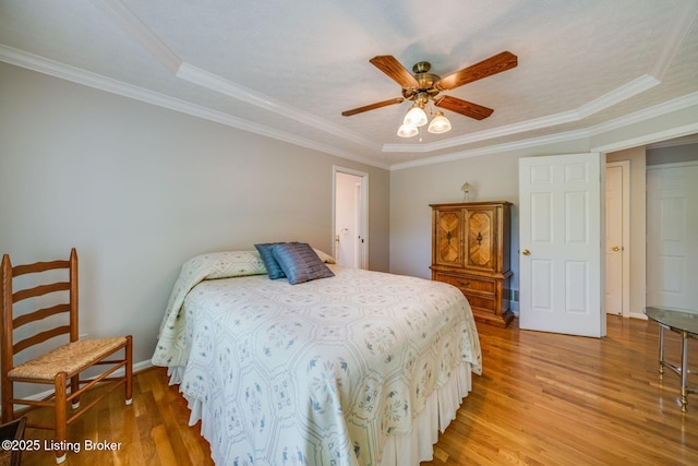 8415 Hurstbourne Woods Pl, Louisville, KY 40299 - bedroom featuring light wood-style floors, crown molding, a ceiling fan, and a tray ceiling