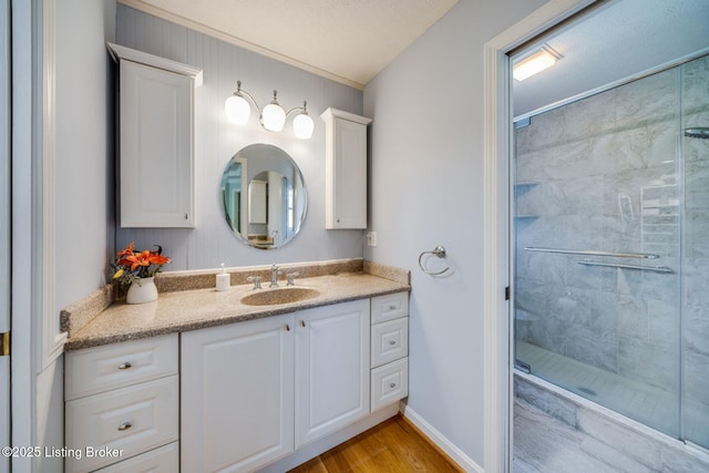 8415 Hurstbourne Woods Pl, Louisville, KY 40299 - full bath with a shower stall, vanity, wood finished floors, and ornamental molding