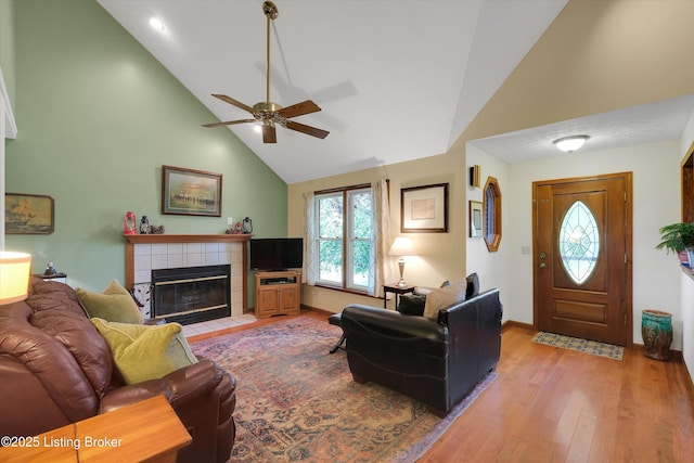 79 Meadow Lake Dr, Taylorsville, KY 40071 - living area featuring high vaulted ceiling, a ceiling fan, wood finished floors, and a fireplace