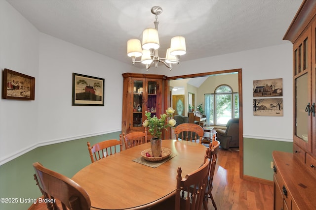 79 Meadow Lake Dr, Taylorsville, KY 40071 - dining room featuring a chandelier and light wood-style floors