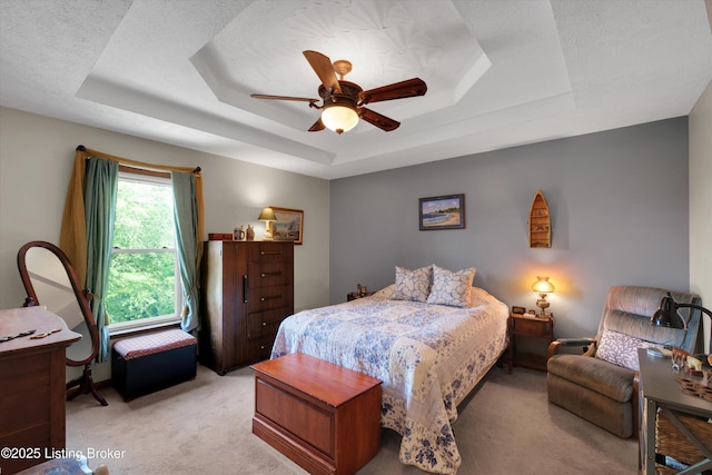 79 Meadow Lake Dr, Taylorsville, KY 40071 - bedroom with a tray ceiling, light carpet, and a ceiling fan