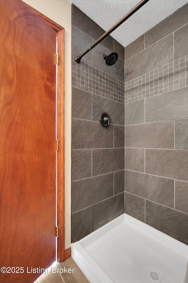 79 Meadow Lake Dr, Taylorsville, KY 40071 - full bathroom with a tile shower and a textured ceiling