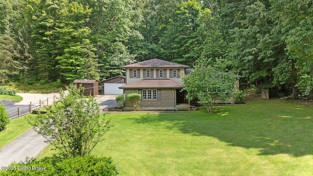 2312 Blevins Gap Rd, Louisville, KY 40272 - view of front of home featuring an outbuilding, a chimney, a detached garage, and a wooded view