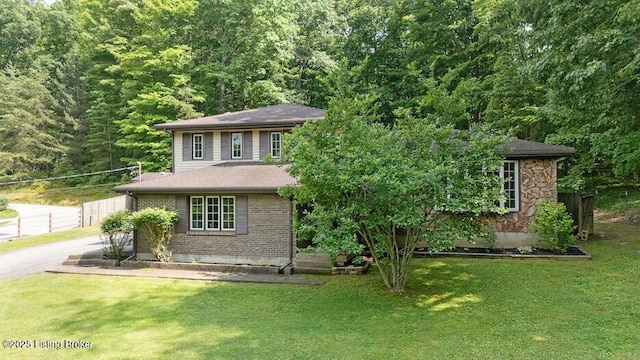 2312 Blevins Gap Rd, Louisville, KY 40272 - view of front facade with a forest view and brick siding