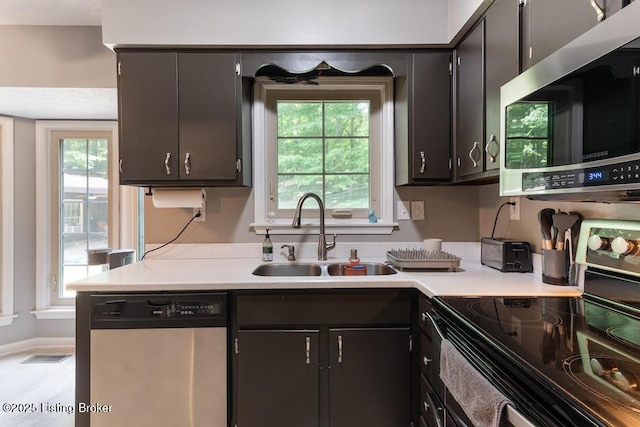 2312 Blevins Gap Rd, Louisville, KY 40272 - kitchen with appliances with stainless steel finishes and light countertops