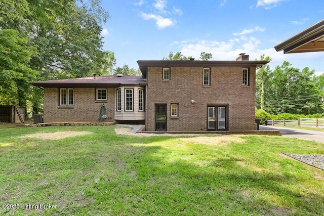 2312 Blevins Gap Rd, Louisville, KY 40272 - back of house with brick siding and a chimney