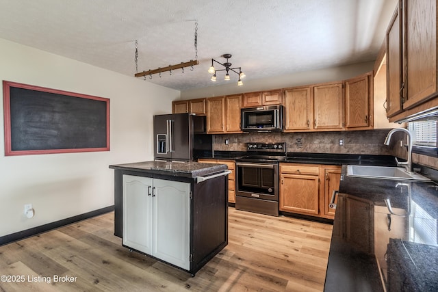 95 Sunny Meadows Dr, Vine Grove, KY 40175 - kitchen with black appliances, a kitchen island, light wood-style floors, decorative backsplash, and a textured ceiling