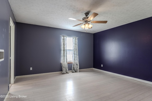 95 Sunny Meadows Dr, Vine Grove, KY 40175 - empty room featuring wood finished floors, a textured ceiling, and a ceiling fan