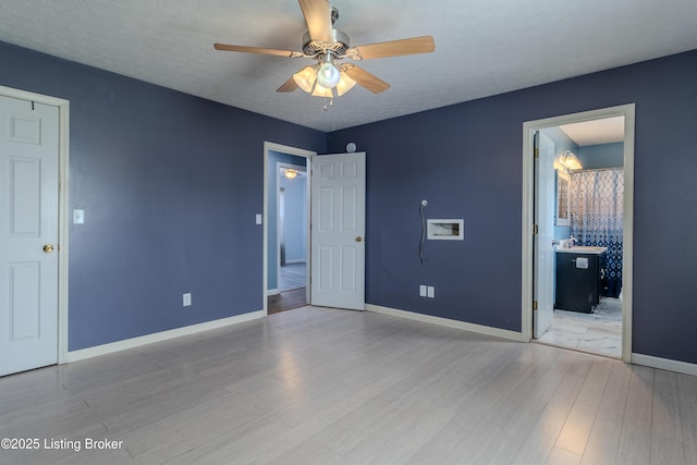 95 Sunny Meadows Dr, Vine Grove, KY 40175 - unfurnished bedroom featuring wood finished floors, a ceiling fan, and ensuite bathroom
