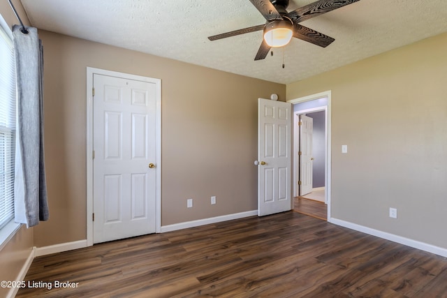 95 Sunny Meadows Dr, Vine Grove, KY 40175 - unfurnished bedroom featuring dark wood-type flooring, a ceiling fan, and a textured ceiling