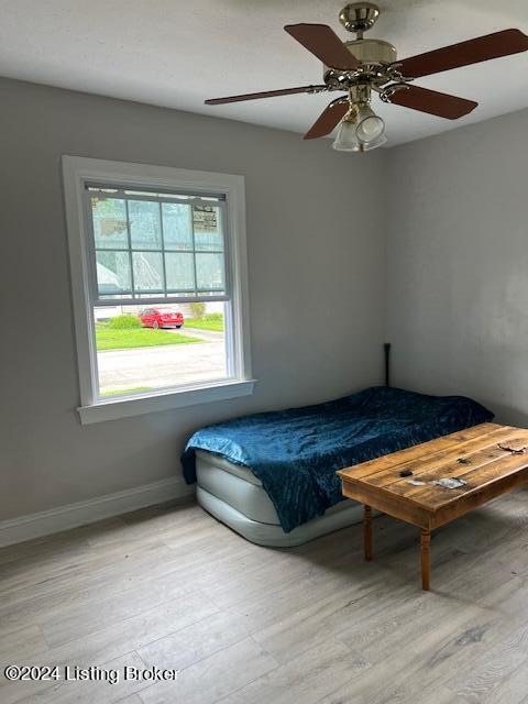 1008 Walter Ave, Louisville, KY 40215 - bedroom with light wood-style floors and a ceiling fan