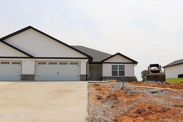 838 Otter Creek Rd, Vine Grove, KY 40175 - view of front of property featuring driveway, stone siding, and an attached garage