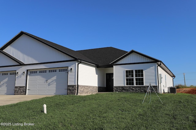 838 Otter Creek Rd, Vine Grove, KY 40175 - view of front of home featuring stone siding, a garage, a front lawn, and driveway