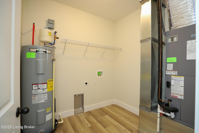 838 Otter Creek Rd, Vine Grove, KY 40175 - utility room featuring electric water heater and heating unit