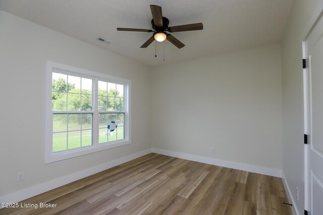 838 Otter Creek Rd, Vine Grove, KY 40175 - spare room with wood finished floors and ceiling fan