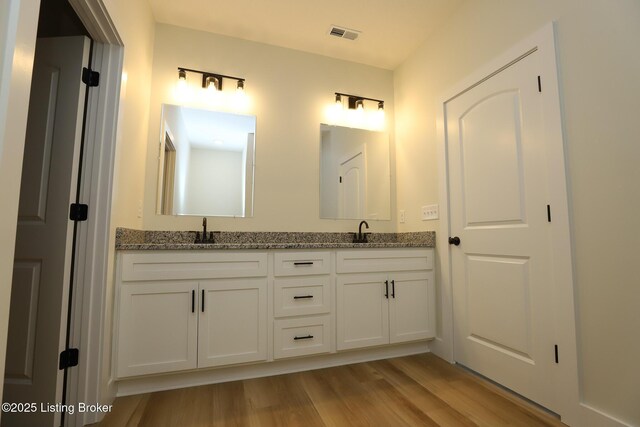 838 Otter Creek Rd, Vine Grove, KY 40175 - full bath with double vanity and wood finished floors