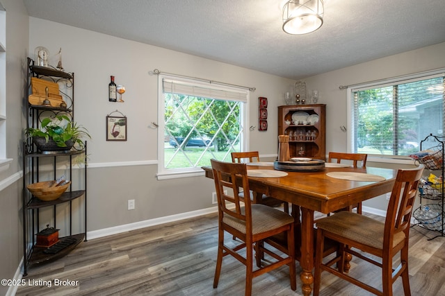 8504 Bambi Way, Louisville, KY 40214 - dining space featuring plenty of natural light, wood finished floors, and a textured ceiling