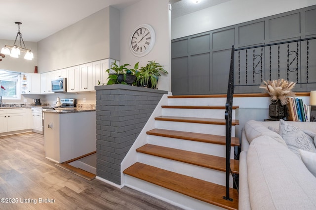 8504 Bambi Way, Louisville, KY 40214 - stairs with wood finished floors and a towering ceiling