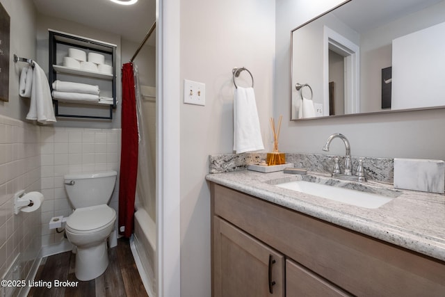 8504 Bambi Way, Louisville, KY 40214 - bathroom featuring wood finished floors, vanity, tile walls, shower / tub combo, and wainscoting