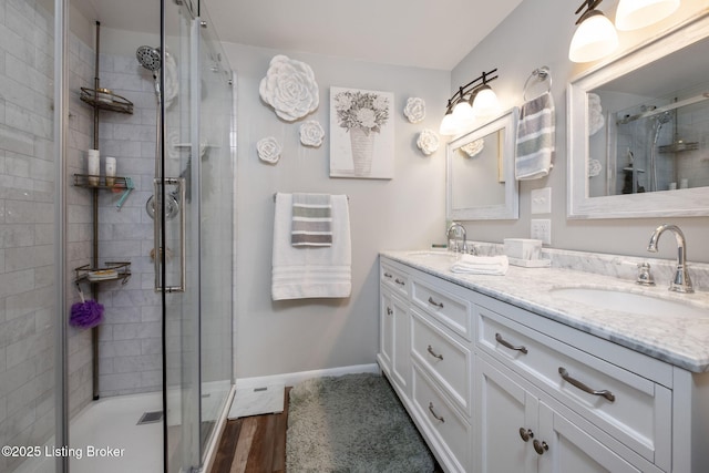 8504 Bambi Way, Louisville, KY 40214 - full bathroom with double vanity, a shower stall, and wood finished floors