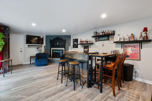 8504 Bambi Way, Louisville, KY 40214 - indoor dry bar with wood finished floors, recessed lighting, and a brick fireplace