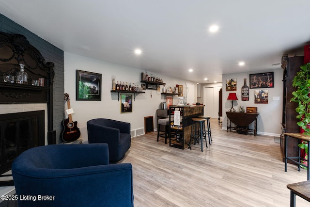 8504 Bambi Way, Louisville, KY 40214 - living area featuring light wood-style flooring, recessed lighting, and a fireplace