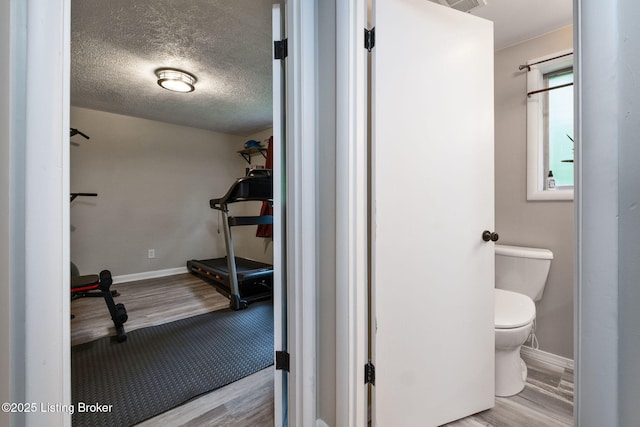 8504 Bambi Way, Louisville, KY 40214 - bathroom featuring wood finished floors and a textured ceiling
