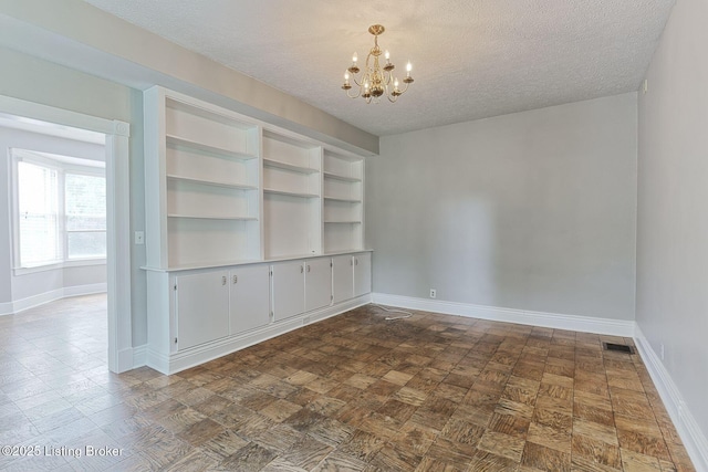 6301 Innisbrook Dr, Prospect, KY 40059 - unfurnished room with a chandelier and a textured ceiling